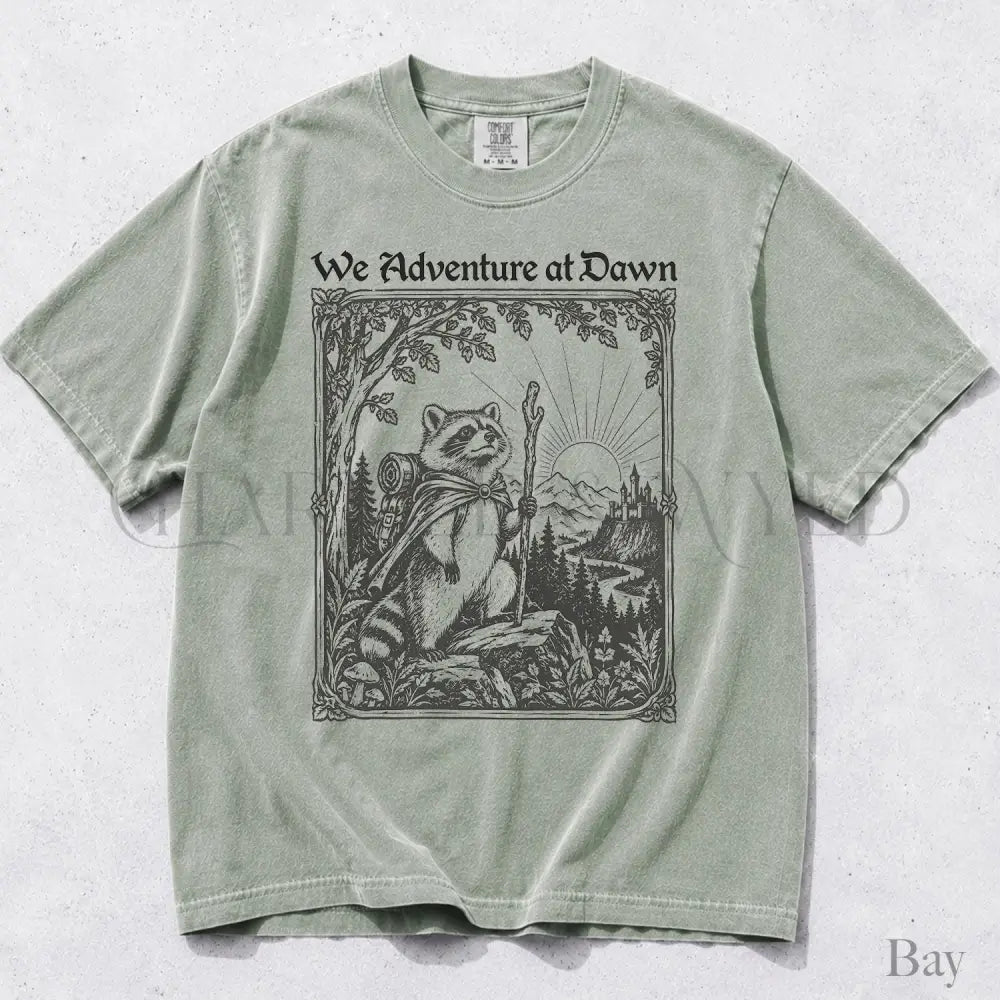 We Adventure at Dawn Hiking Raccoon Comfort Colors T-Shirt - Bay / S - T-Shirt