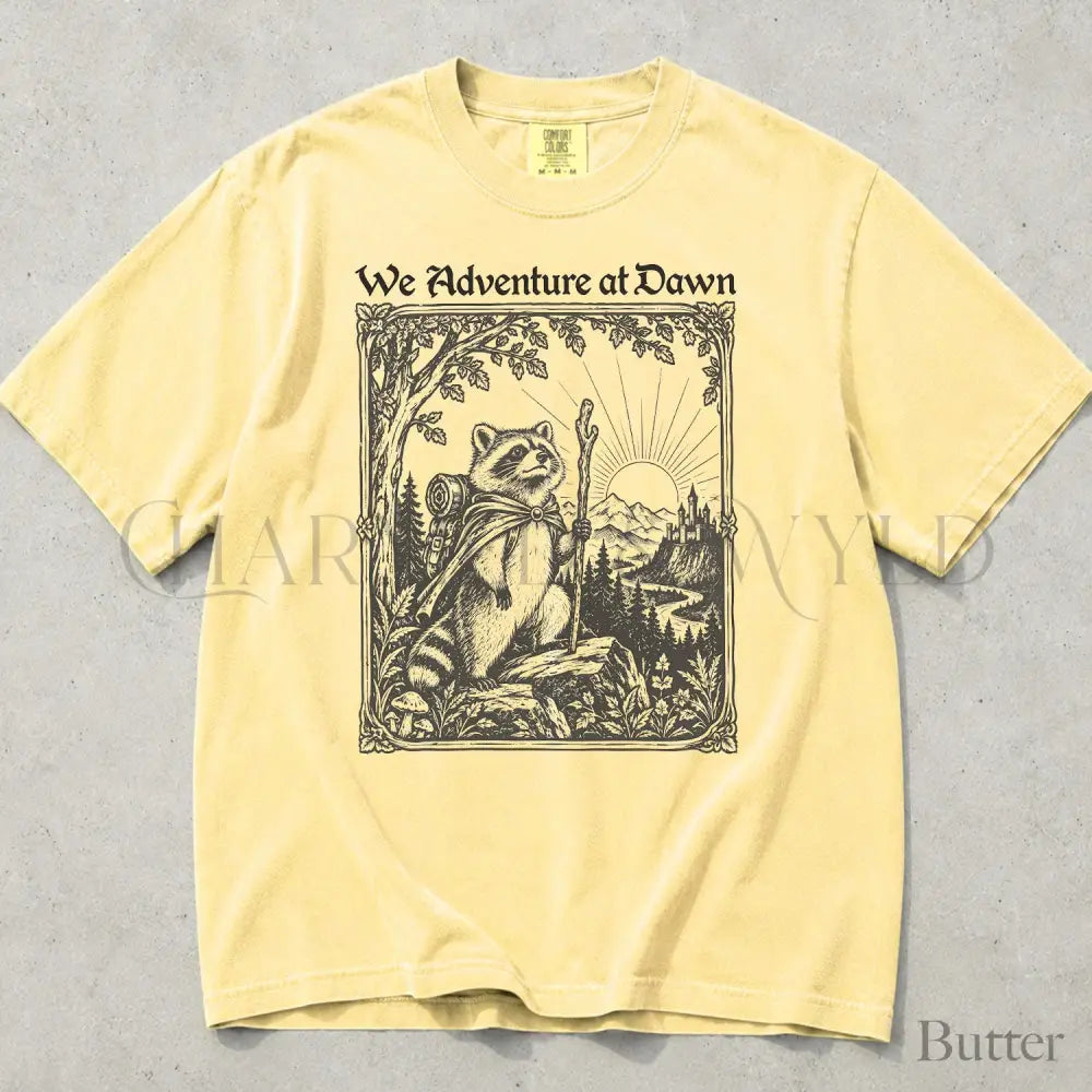We Adventure at Dawn Hiking Raccoon Comfort Colors T-Shirt - Butter / S - T-Shirt