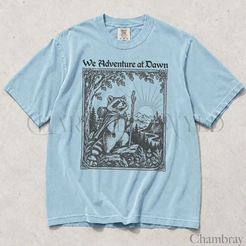 We Adventure at Dawn Hiking Raccoon Comfort Colors T-Shirt - Chambray / S - T-Shirt